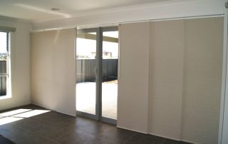 Sliding panel blinds for sliding door in a living room at a house in Perth